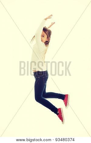 Little pretty girl jumping with joy