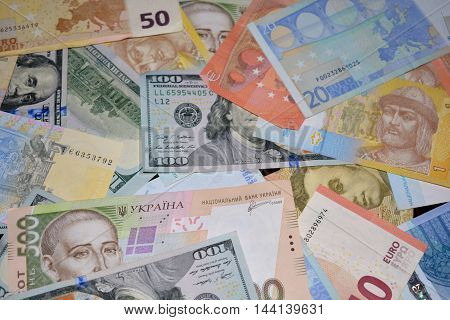 raskidanaye on the table money (hryvnia, dollars, euros)