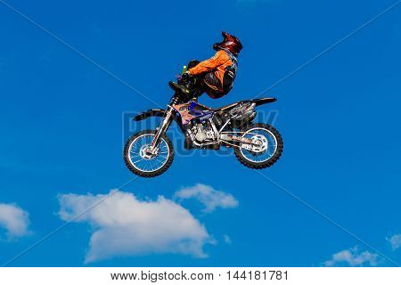 August 6 2016. Ryazan Russia. A professional rider at the FMX (Freestyle Motocross) make an acrobatic jump at the motorshow. Documentary Editorial Image.