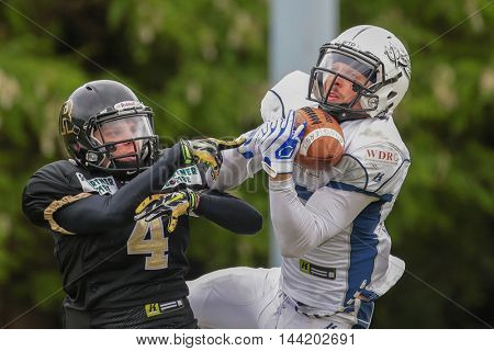 MOEDLING, AUSTRIA - MAY 24, 2015: WR Christian Steffani (#83 Devils) catches the ball in a game of the Division I of the Austrian Football League.