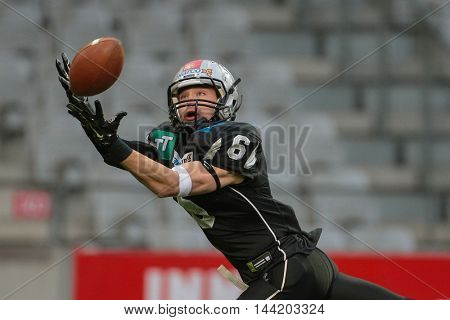 INNSBRUCK, AUSTRIA - MAY 2, 2015: WR Kyle Callahan (#6 Raiders) catches the ball in a game of the Big SIx Football League.