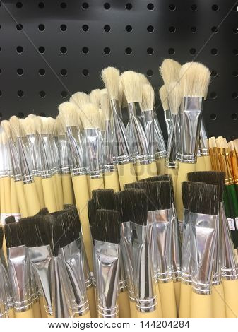 Blurred paint brushes in a stationery store.
