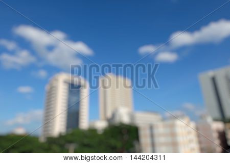 Image blur  building and blue sky background.