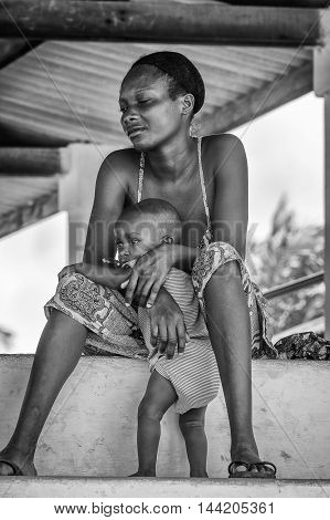 KARA, TOGO - MAR 9, 2013: Unidentified Togolese boy and his mother portrait. Children in Togo suffer of poverty due to the unstable econimic situation