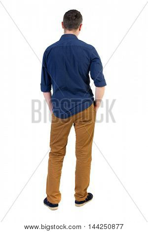 Back view of man . Standing young guy. Rear view people collection.  backside view of person.  Isolated over white background. a man in a blue shirt with the sleeves rolled up, standing with his hands