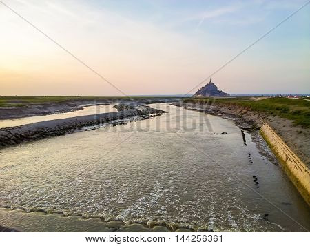 Couesnon river and Mont Saint-Michel - tidal island town and abbey. France