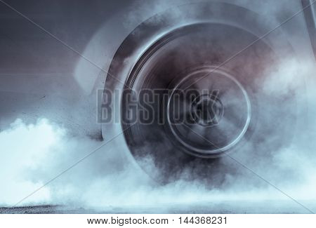 Drag Racing Car Burns Rubber Off Its Tires In Preparation For The Race