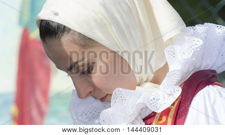CAGLIARI, ITALY - May 1, 2014: 358 ^ Religious Procession of Sant'Efisio - Sardinia - portrait of a beautiful girl in traditional Sardinian costume