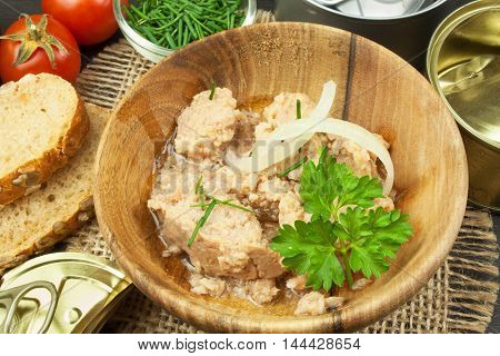Crushed tuna canned. The fishing industry, canned fish. Diet food. Tinned tuna. Bowl with canned Tuna. Domestic food preparation.