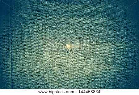 Torn jeans or denim on texture, background concept.