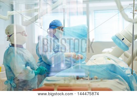 Surgeons operating