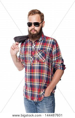 young attractive man posing in sunglasses and a jacket over his shoulder