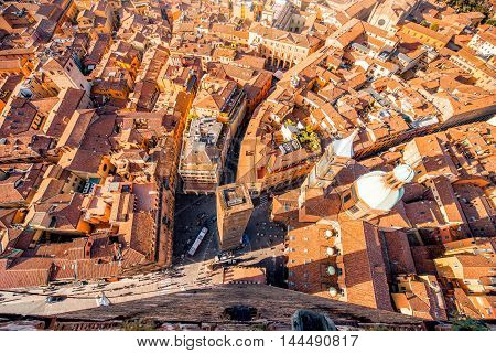 Aerial cityscape view from the tower on Bologna old town with Garisenda tower and roman catholic church