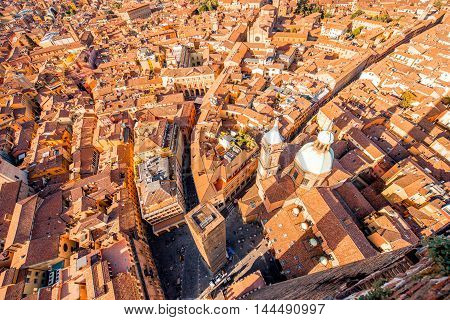 Aerial cityscape view from the tower on Bologna old town with Garisenda tower and roman catholic church