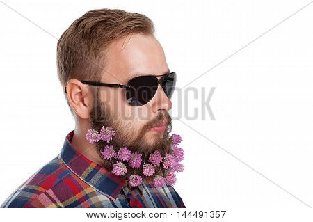 Portrait of handsome man with beard of clover flowers isolated on white