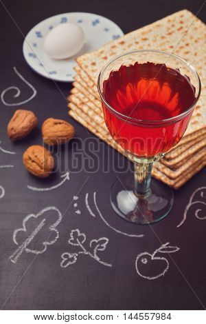 Jewish holiday Passover celebration with matzo and wine on chalkboard