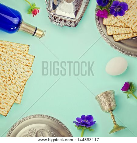 Jewish holiday Passover background with matzo wine and flowers