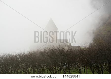 Ancient monastery Tatev covered with clouds in the mountains of Armenia. Was founded in year 906. 