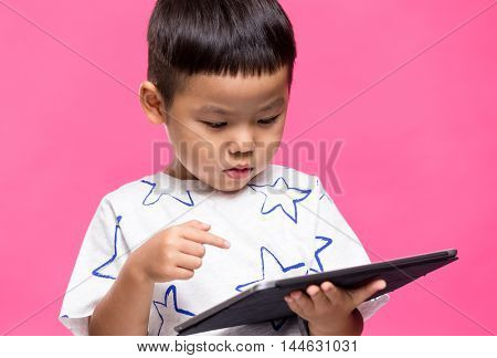Little boy using dgital tablet