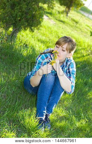 Portrait of a girl in a park on the grass