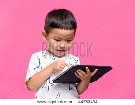 Little kid using dgital tablet