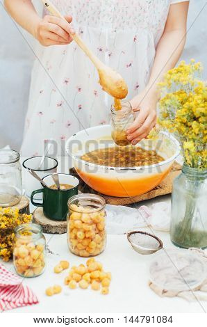 Raspberries Jam. Female Hand Making Jam, On A Rustic White Table