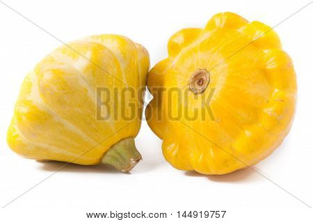 two yellow pattypan squash isolated on white background.