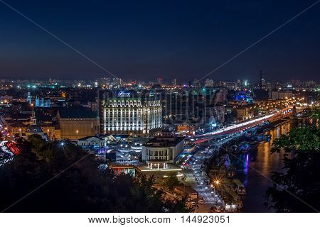 August 26, 2016: Ukraine, Kiev, Night. View of the Dnieper River and area Podol.