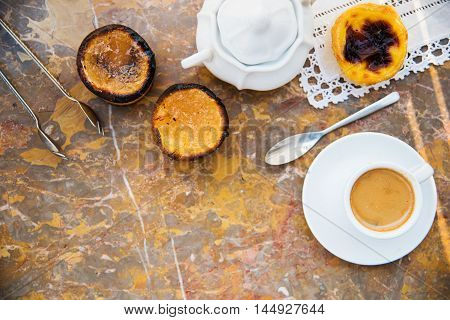 Conceived with the morning coffee and cakes (Pasteis de nata, typical pastry from Portugal) on natural marble surface.