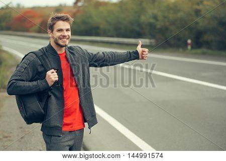 Young Man Hitchhiking