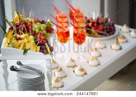 Image Of Strawberry Cocktails, Strawberries And Grapes, Cakes At A Buffet Table