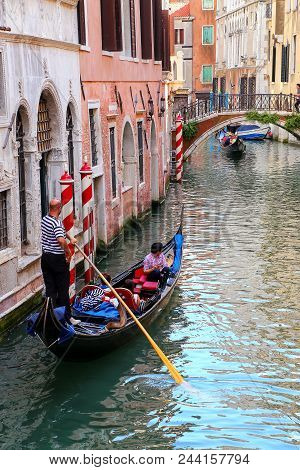 Venice, Italy-june 21: Unidentified People Ride In Gondola On June 21, 2015 In Venice, Italy. Venice