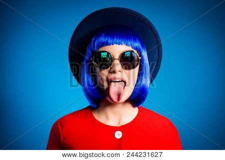 Head Shot Portrait Of Crazy Foolish Girl In Headwear Eyewear Red Outfit Wig Gesturing  Tongue Out Is