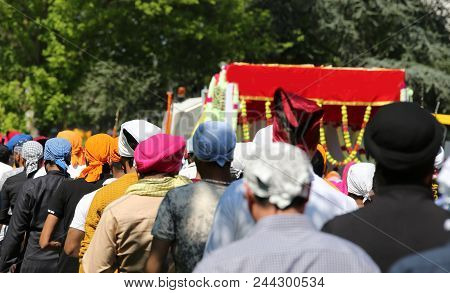 Many Sikh Men During The Religious Rite On The Road