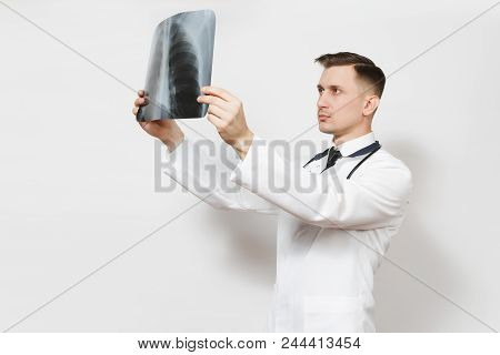 Perplexed Focused Doctor Man With X-ray Of Lungs, Fluorography, Roentgen Isolated On White Backgroun