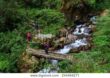 Khopra, Nepal - Oct 23, 2017. People With Backpack Walking On Trail Of Annapurna Circuit Trekking In