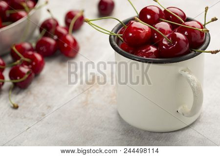 Fresh cherry on wooden background. fresh ripe cherries. sweet cherries.