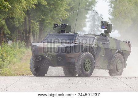 German Light Armoured  Reconnaissance Vehicle Drives On A Road