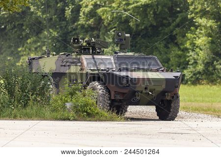 German Light Armoured  Reconnaissance Vehicle Drives On A Road