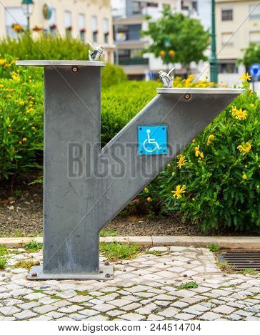 Public Water Fountain For Disaibled People In Whell Chair In A Garden In Mafra Portugal