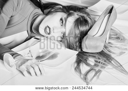 Fashion Model Posing On Camera. Sensual Elegant Glamour Young Drunk Woman With Beautiful Hair Lying 