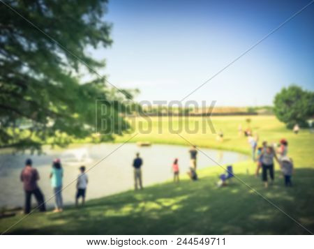 Vintage Blurred Family With Kids Fishing In Pond In Summer