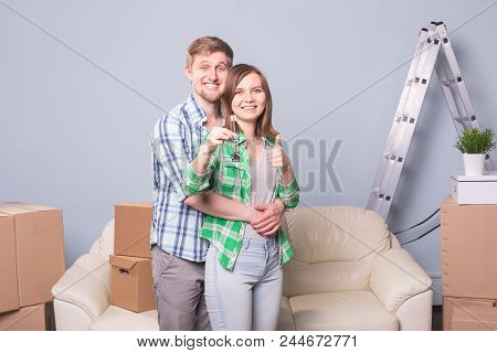 Happy Woman In Her New Home Holding Key
