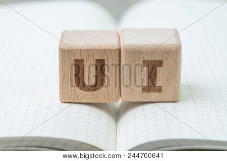 Ui, User Interface Design Concept, Cube Wooden Block With Alphabet U And I On Grid Line Note Book, C
