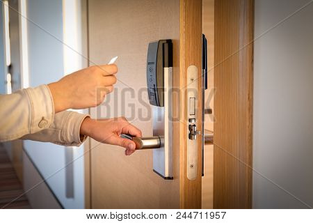 Opening A Hotel Door With Keyless Entry Card.