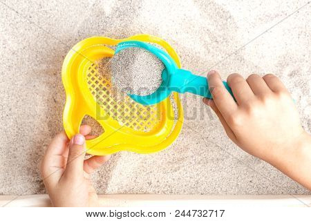 The Child Plays, Pours Sea Sand. Rest On The Sea