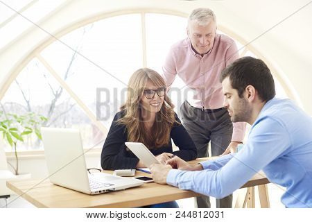 Group Of Business People Working Together On New Project