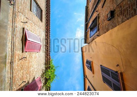 Ferrara, Italy - June, 9, 2018: roofs of the old houses in Ferrara, Italy