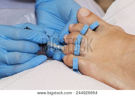 Woman Feet Receiving Pedicure. Close Up Concept