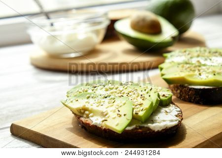 Vegan Sandwich, Rye Bread Toast, Avocado Slices And Raw Arugula. Toasted Sourdough, Eggless Mayonnai